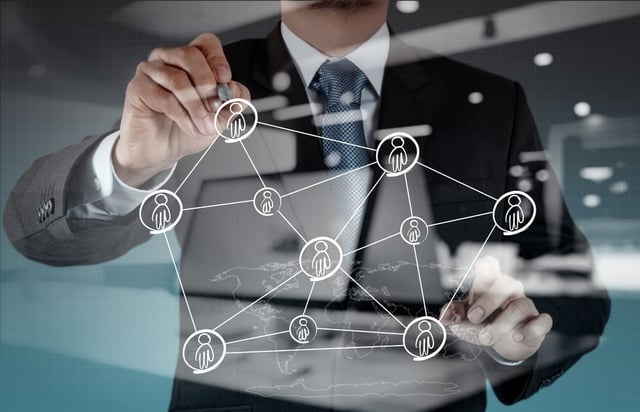 Double exposure of businessman working with new modern computer show social network structure.jpeg