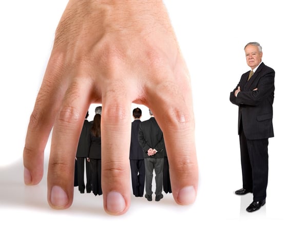 business team underneath a hand over a white background while their boss in next to them